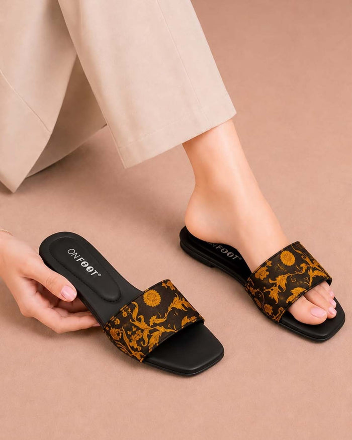 Cushion Lane black ethnic floral flat slippers by ON FOOT - front view