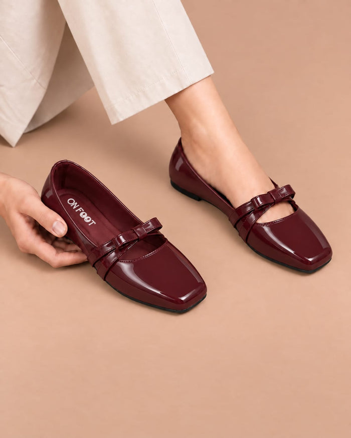 Maroon Luxe Bow Pumps by ON FOOT - glossy patent bow pumps, front view