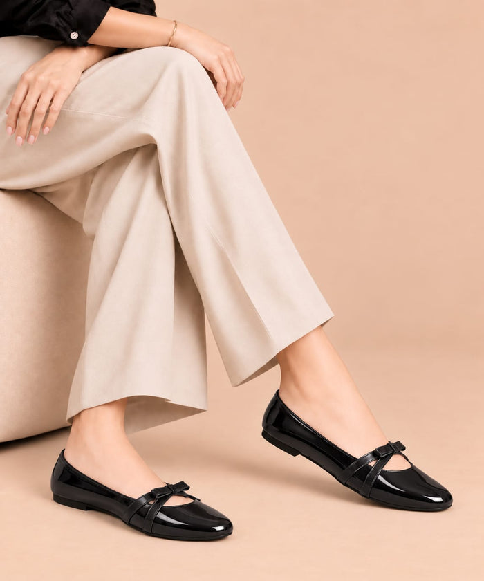Black Luxe Bow Pumps by ON FOOT - glossy patent bow pumps, side view